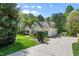 Attractive two-story home with well-manicured landscaping and a long driveway leading to the garage at 255 Williamston Ridge Dr, Youngsville, NC 27596