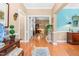 Inviting foyer with hardwood floors, soft, neutral paint, and elegant decor setting a tone of sophisticated charm at 255 Williamston Ridge Dr, Youngsville, NC 27596
