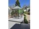 Backyard greenhouse with surrounding garden beds and a view of the main house at 255 Williamston Ridge Dr, Youngsville, NC 27596