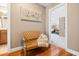 Inviting hallway with bench, artwork, and doorway to a brightly lit room with plush carpeting at 255 Williamston Ridge Dr, Youngsville, NC 27596