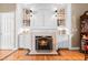 Elegant fireplace with custom built-ins, adding warmth and character to this inviting living space at 255 Williamston Ridge Dr, Youngsville, NC 27596