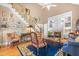 Cozy living room with a fireplace, hardwood floors, staircase, and eclectic decor at 255 Williamston Ridge Dr, Youngsville, NC 27596