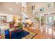 Spacious living area with staircase and hardwood floors, providing an open and airy ambiance at 255 Williamston Ridge Dr, Youngsville, NC 27596