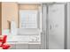 Relaxing main bathroom with a soaking tub, separate shower, and abundant natural light at 255 Williamston Ridge Dr, Youngsville, NC 27596