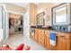 Elegant main bathroom with double vanities, granite countertops, and a walk-in closet at 255 Williamston Ridge Dr, Youngsville, NC 27596