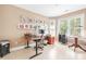 Bright home office with large windows, built-in shelving, and ample workspace at 255 Williamston Ridge Dr, Youngsville, NC 27596