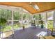 Bright sunroom with skylight and large windows, perfect for enjoying the serene backyard view at 255 Williamston Ridge Dr, Youngsville, NC 27596