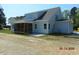Enjoy outdoor living with a screened porch and spacious backyard, perfect for relaxation at 2617 Packhouse Rd, Zebulon, NC 27597