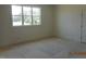 Bedroom featuring a large window that allows natural light to illuminate the interior at 2617 Packhouse Rd, Zebulon, NC 27597