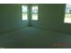 Light-filled bedroom with multiple windows providing natural light at 2617 Packhouse Rd, Zebulon, NC 27597