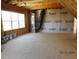 Bonus room with exposed wood framework and windows providing natural light at 2617 Packhouse Rd, Zebulon, NC 27597