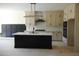 Modern kitchen features sleek island, contemporary appliances, and stylish cabinetry for culinary enthusiasts at 2617 Packhouse Rd, Zebulon, NC 27597
