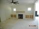 Spacious living room with fireplace and built-in cabinetry, offering comfort and style at 2617 Packhouse Rd, Zebulon, NC 27597