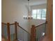 Stylish staircase with dark metal railings and abundant natural light at 2617 Packhouse Rd, Zebulon, NC 27597