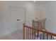 Elegant staircase with wooden rails and black metal spindles at 2617 Packhouse Rd, Zebulon, NC 27597