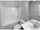 Neutral bathroom featuring a tub with shower, toilet, and single sink vanity with mirror at 30 Alvis Ct, Fuquay Varina, NC 27526