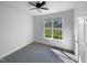 Bedroom with carpet, window, and ceiling fan at 30 Alvis Ct, Fuquay Varina, NC 27526