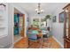 Dining room with hardwood floors, classic furniture, and kitchen access at 3011 Kenan Rd, Durham, NC 27704