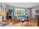 Bright living room featuring hardwood floors, bay window and neutral walls at 3011 Kenan Rd, Durham, NC 27704