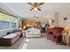 Inviting open-concept living room featuring a large window, hardwood floors, and comfortable seating at 3011 Kenan Rd, Durham, NC 27704