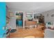 Open living area with hardwood floors, gray walls, and view to kitchen at 3011 Kenan Rd, Durham, NC 27704