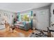 Cozy living room with bay window, hardwood floors, and ample natural light at 3011 Kenan Rd, Durham, NC 27704