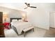 This bedroom features a ceiling fan, natural light, and a decorative wall with unique style at 3016 Sylvania Dr, Raleigh, NC 27607