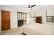 This bedroom features natural light, a ceiling fan, and an en suite bathroom at 3016 Sylvania Dr, Raleigh, NC 27607