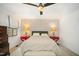 This bedroom features a ceiling fan, natural light, and a decorative wall with unique style at 3016 Sylvania Dr, Raleigh, NC 27607