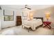 This bedroom features a ceiling fan, natural light, and a decorative wall with unique style at 3016 Sylvania Dr, Raleigh, NC 27607