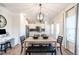 Open concept kitchen and dining area with modern lighting and stylish furnishings at 306 Deodora Ln, Cameron, NC 28326
