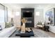 Cozy living room with modern fireplace, stylish decor, and comfortable seating arrangement at 306 Deodora Ln, Cameron, NC 28326