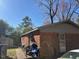 Exterior view of brick house with a side patio at 3413 Renee Dr, Sanford, NC 27332