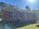 Charming brick home with a well-maintained lawn and traditional design at 3413 Renee Dr, Sanford, NC 27332