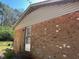 Exterior view of a brick home with vinyl siding and a back entrance at 3413 Renee Dr, Sanford, NC 27332