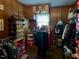Functional walk-in closet with wood-paneled walls with clothing racks and shoe storage at 3414 Renee Dr, Sanford, NC 27332