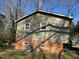 Back of the home showing the siding, windows, and brick foundation at 3414 Renee Dr, Sanford, NC 27332