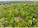 A distant aerial view of the home surrounded by dense foliage at 3518 Travis Ct, Chapel Hill, NC 27516
