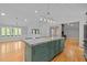 Open kitchen with stainless steel appliances and granite countertops at 3518 Travis Ct, Chapel Hill, NC 27516