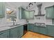Stylish kitchen boasts granite countertops and stainless steel appliances at 3518 Travis Ct, Chapel Hill, NC 27516