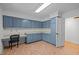 Spacious laundry room with ample storage, cabinets, countertops, and tiled floors at 3518 Travis Ct, Chapel Hill, NC 27516