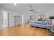 Main bedroom with hardwood floors, vaulted ceiling, and access to an outdoor deck area at 3518 Travis Ct, Chapel Hill, NC 27516