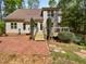 The backyard features a wooden deck and a brick patio area perfect for entertaining at 3638 Pine Needles Dr, Wake Forest, NC 27587