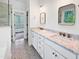Bathroom with double vanity, marble countertops, and stylish tile flooring at 3638 Pine Needles Dr, Wake Forest, NC 27587