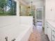 The bathroom features a soaking tub, a glass shower, and a marble vanity at 3638 Pine Needles Dr, Wake Forest, NC 27587
