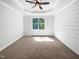Bright bedroom with a large window and neutral carpet; a blank canvas for your personal touch at 3638 Pine Needles Dr, Wake Forest, NC 27587