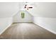 Bright bonus room with a window and sloped ceiling offers a versatile living space at 3638 Pine Needles Dr, Wake Forest, NC 27587