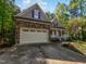 Charming home featuring a stone facade, attached two-car garage, covered porch and lovely curb appeal at 3638 Pine Needles Dr, Wake Forest, NC 27587