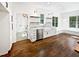 Bright kitchen with white cabinets, stainless steel appliances, and open shelving at 3638 Pine Needles Dr, Wake Forest, NC 27587