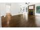 Open living room with hardwood floors, a stone fireplace, and ample natural light at 3638 Pine Needles Dr, Wake Forest, NC 27587